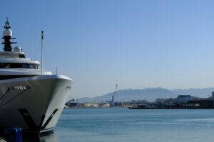 luxury yacht docked in a Mediterranean marina — APA yacht charter port and marina fees