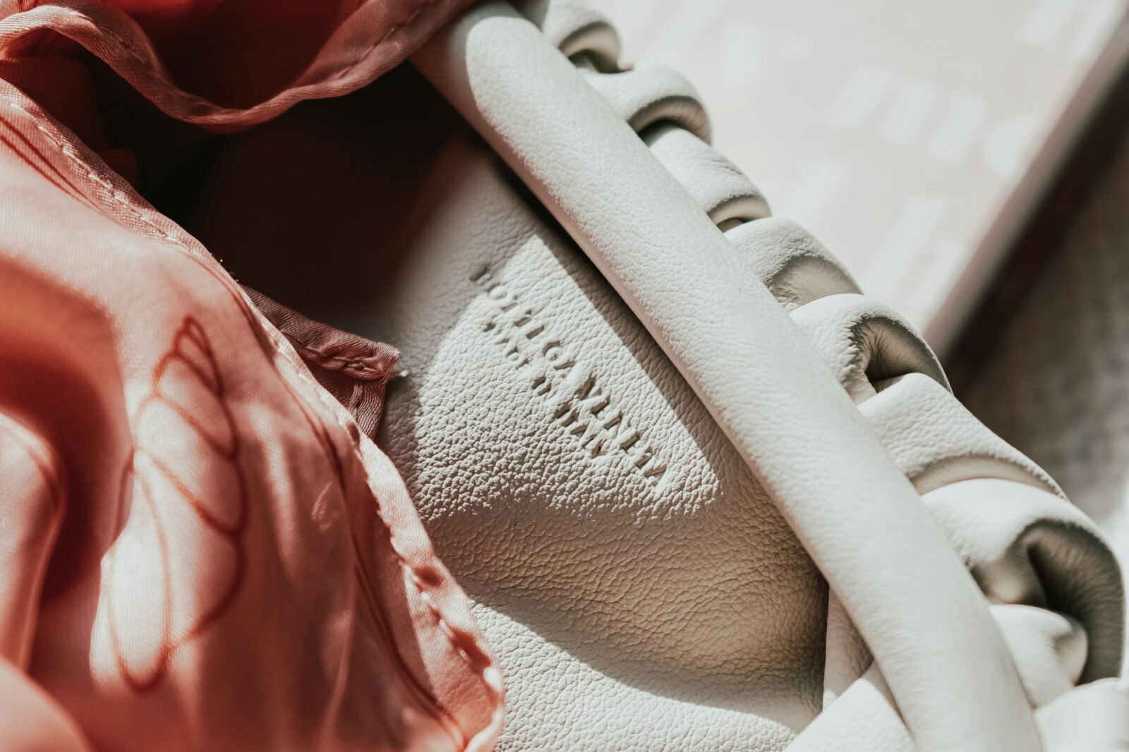 Luxury handbag on the deck of a superyacht, reflecting refined yacht charter etiquette and elegant onboard style.