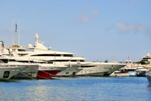 Luxury superyachts moored side by side at a Monaco superyacht berth