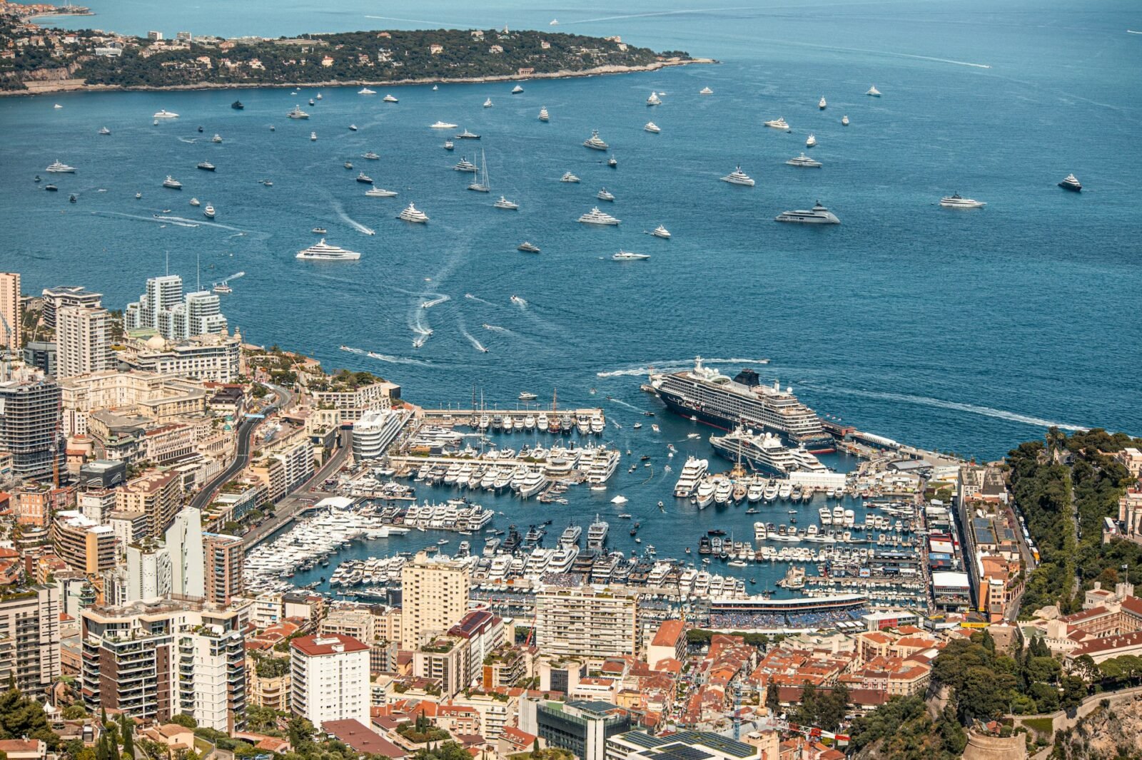 Superyacht berths in Monaco seen above Fontvieille Harbour, showing the limited marina space and surrounding cityscape
