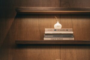 warm wood yacht interior shelving with soft lighting and minimal object composition